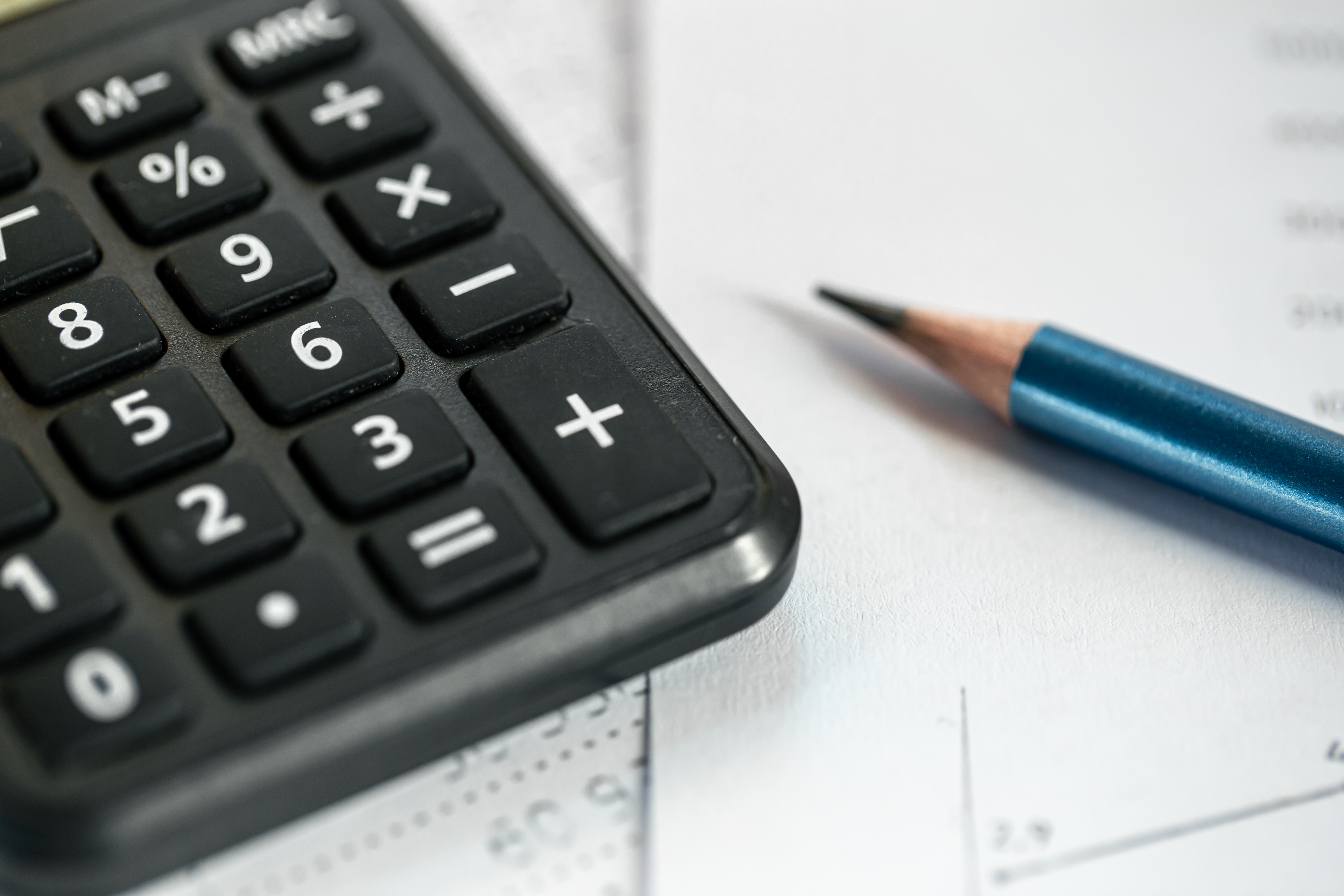 calculator-pencil-closeup-blurred-background.jpg